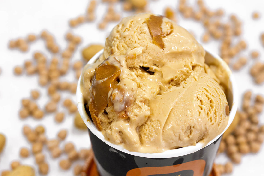 A close-up photo of Peanut Butter Bomb with chickpeas in the background.