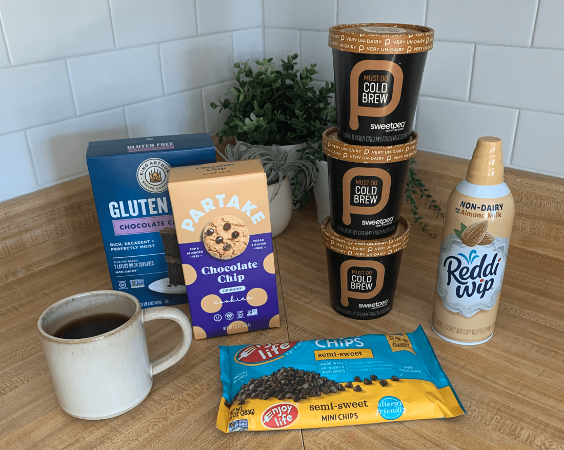 Ingredients for making plant-based ice cream cake arranged on a wooden counter.